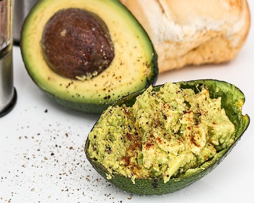 Close up of a fresh salad with beans and avocado, traditional Mexican healthy ingredients